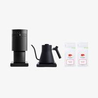 Fellow Black coffee maker and kettle with two bags of coffee on a white background