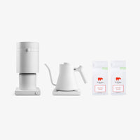 Fellow White coffee maker and kettle with two boxes of coffee on a white background