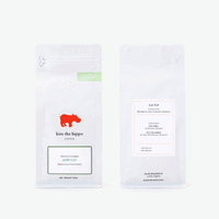 Front and back of a Kiss the Hippo Low Caf 250g coffee bag
