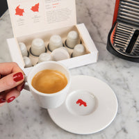 Office employee drinking sustainable coffee pods, part of their office subscription delivery for their team.