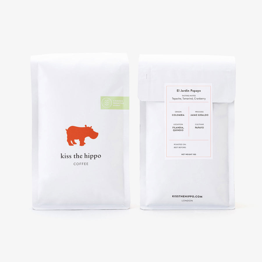 Two coffee packages from 'kiss the hippo' on a white background