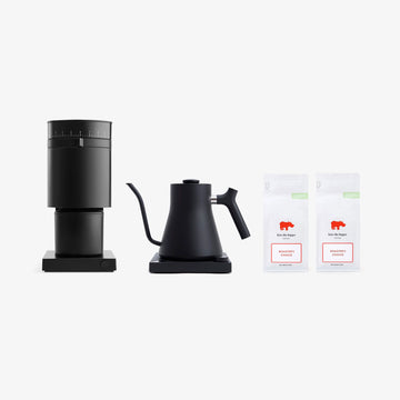 Fellow Black coffee maker and kettle with two bags of coffee on a white background