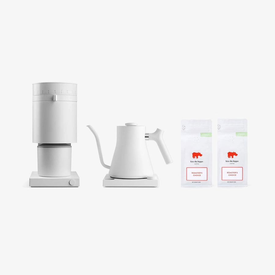 Fellow White coffee maker and kettle with two boxes of coffee on a white background