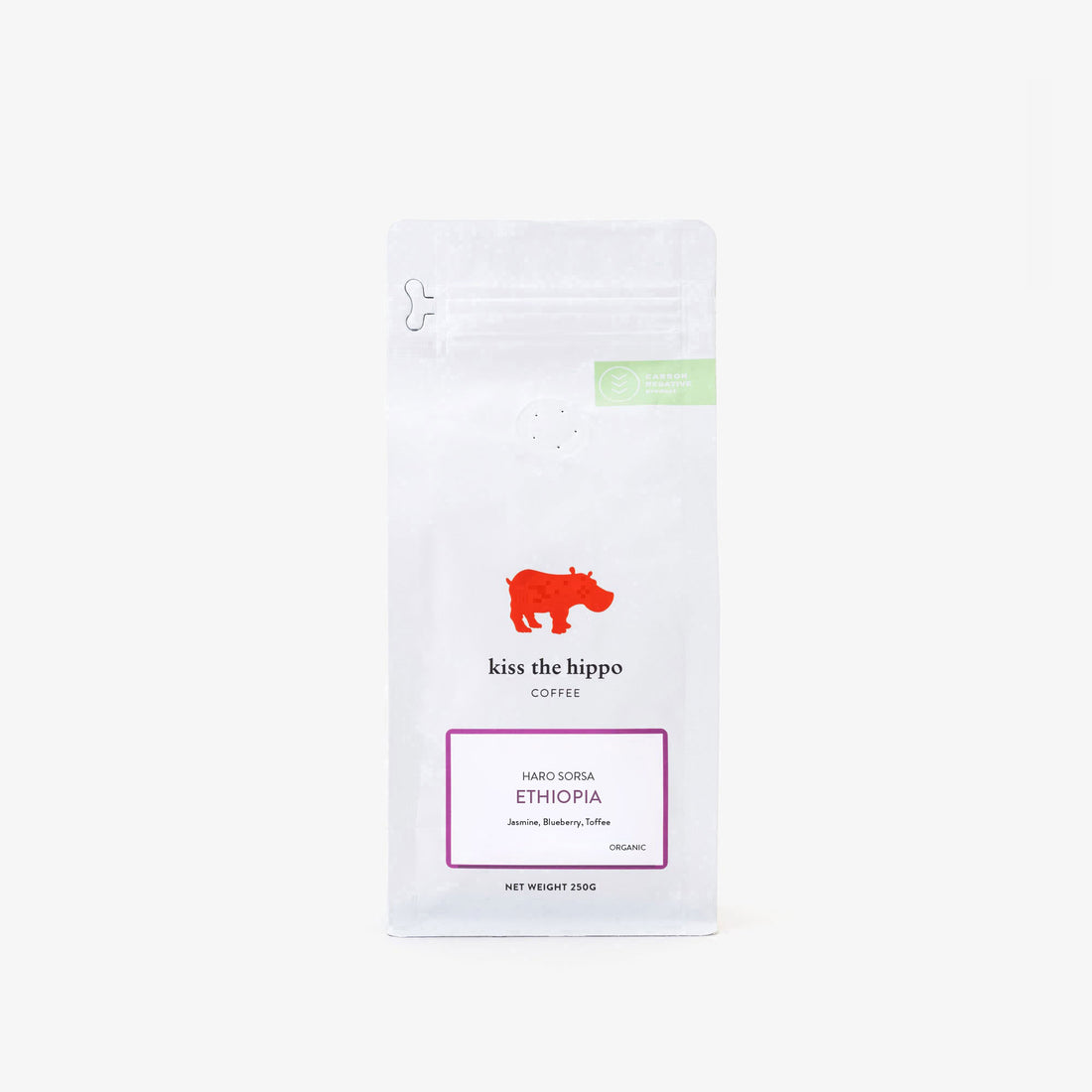 Coffee package with 'Kiss the Hippo' branding on a white background