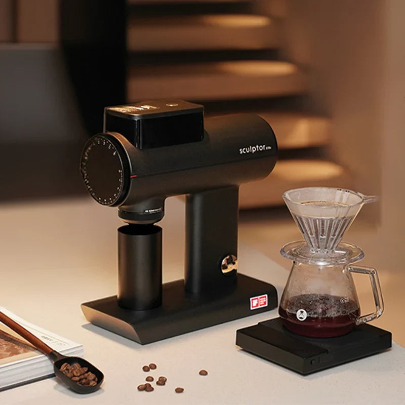 Timemore Sculptor in black beside a V60 pour-over and brewing scale