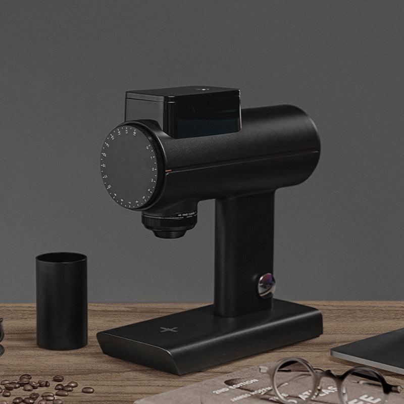 Timemore Sculptor coffee grinder in black with dosing cup, hero shot