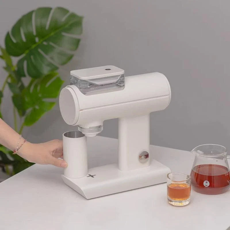 Hand catching a dose cup under a Timemore Sculptor in white